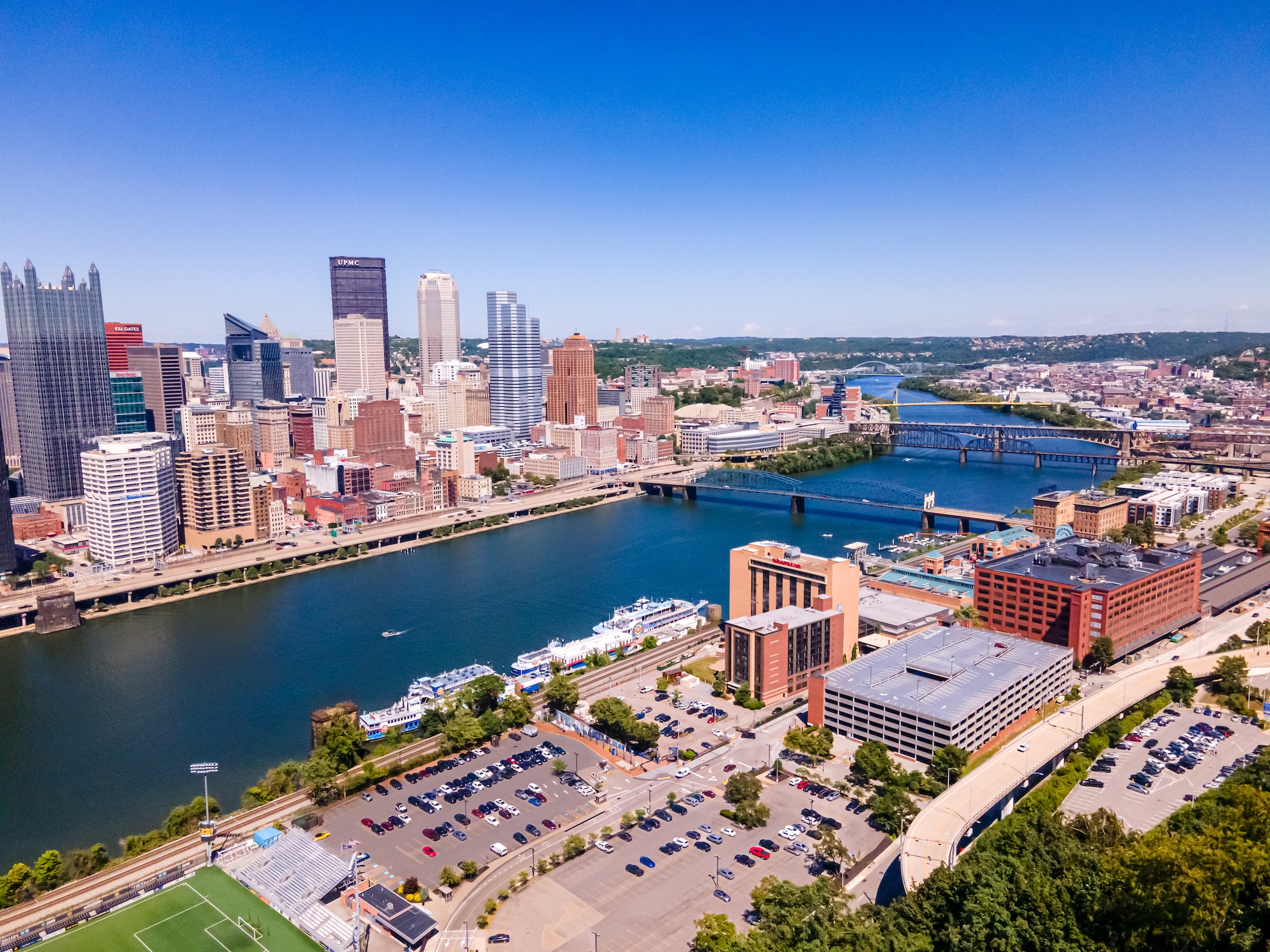 An aerial view of the Pittsburgh skyline and the rivers.