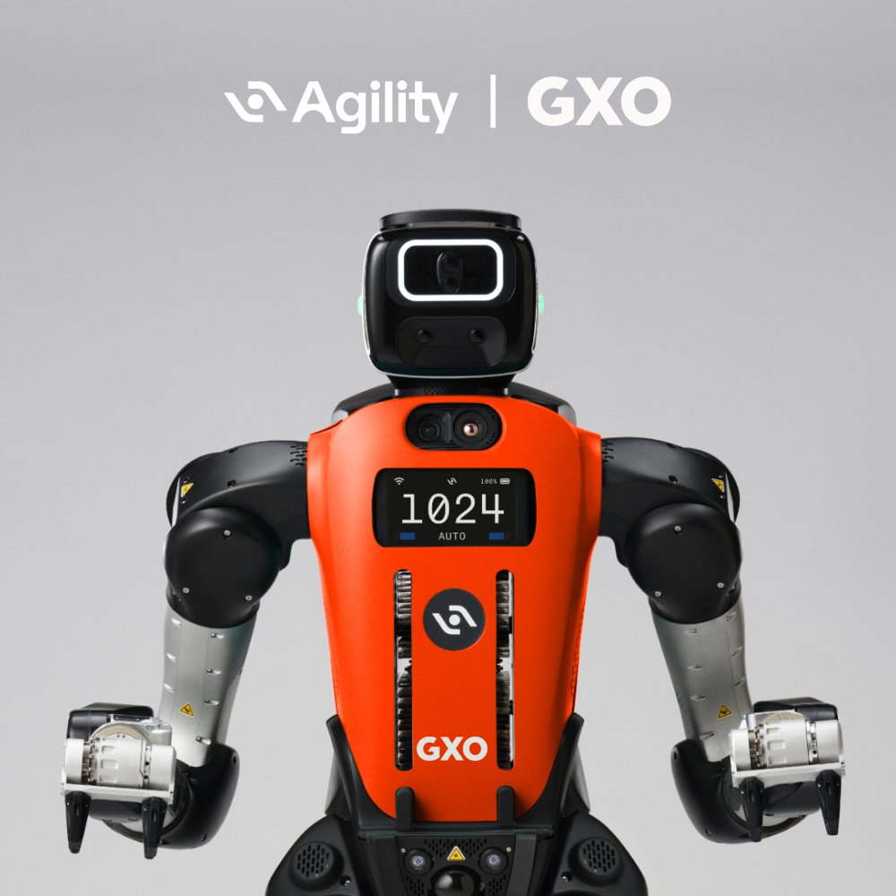 Agility’s Digit robot, in orange, with the GXO name on its back.